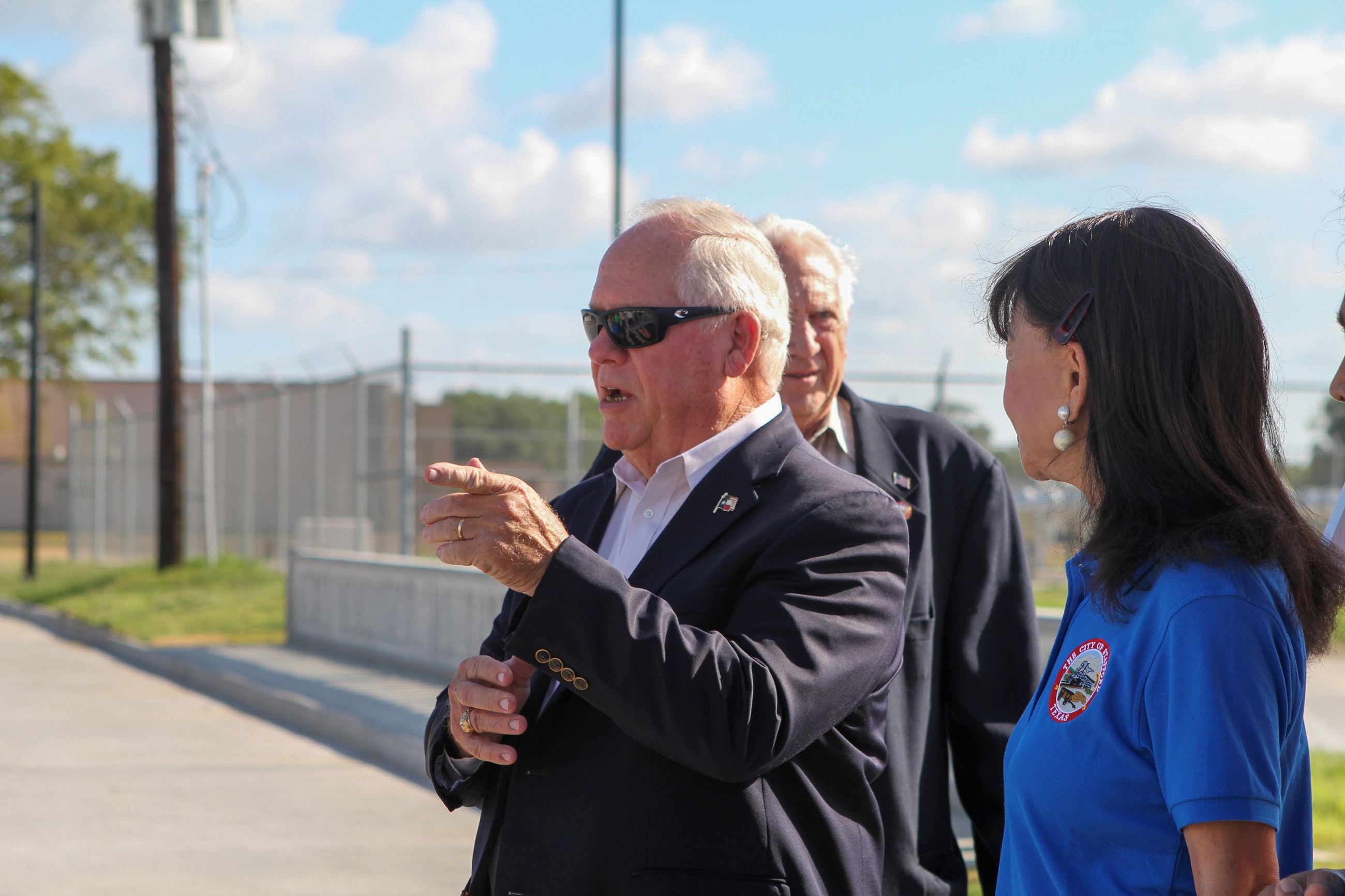 Speeches before the ribbon cutting at Trinity Drive