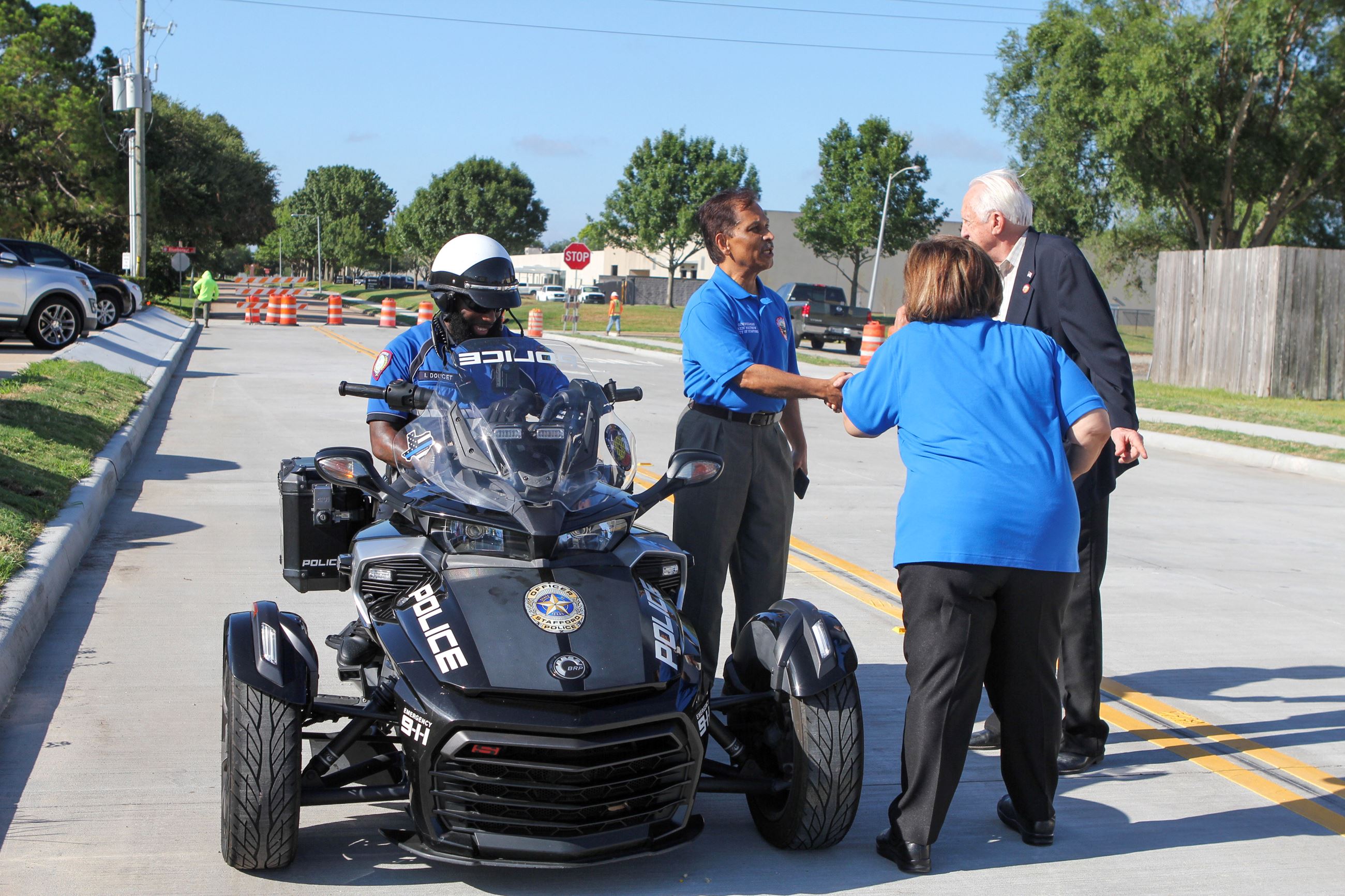 Mayor and council members talking in front of police