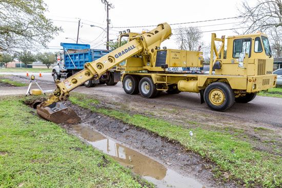 Large machinery making ditch